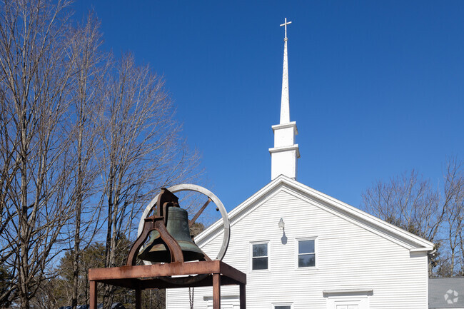 The gentle ringing of the church bell from the Poland Community Church carries across the town.
