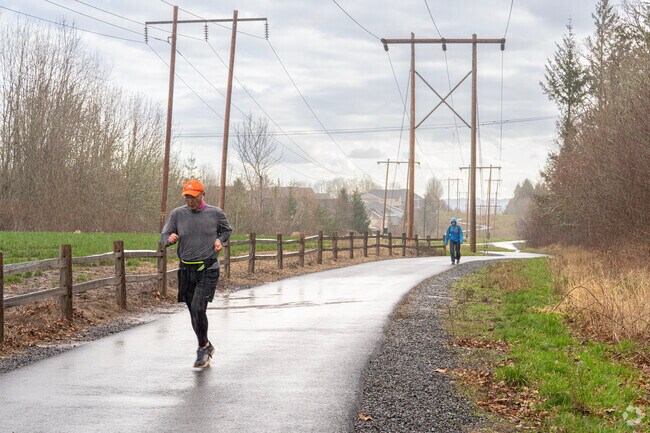 Residents enjoy jogging in the rain along the Westside Regional trail.