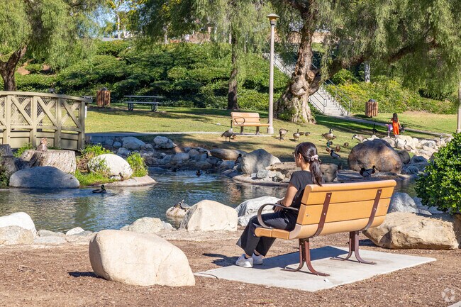 Residents fish and relax at Eisenhower Park’s scenic lake.