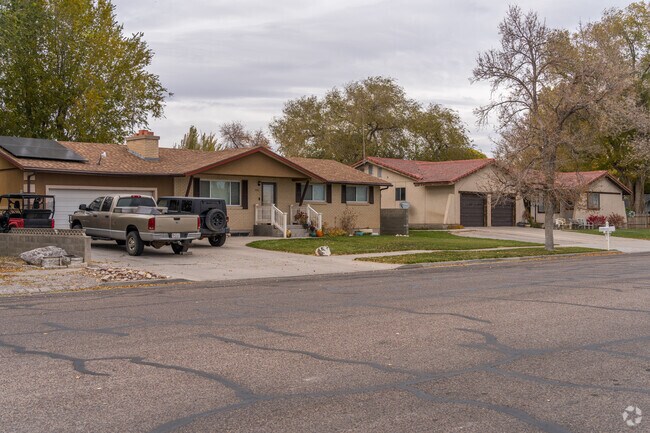 Ranch-style homes cluster along wide streets with street parking.