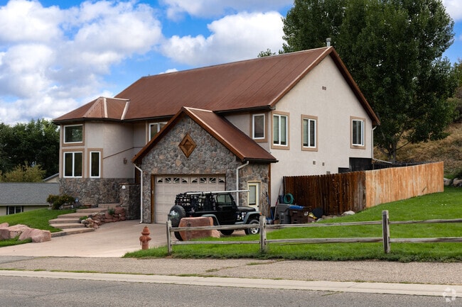 Some Silt homes feature stone accents and mountain views.