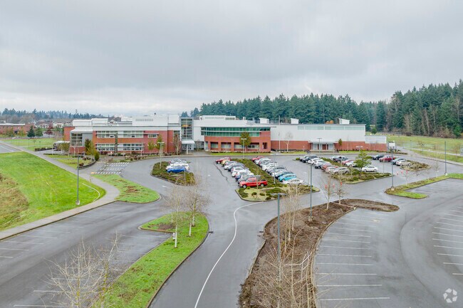 View of drive into school with parking.