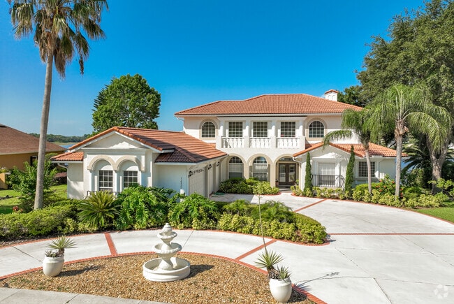 A stunning two-story home in Clermont boasts a beautiful tile roof.