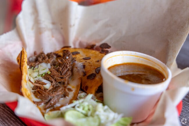 Locals in Pueblo Gardens love El Taco Rustic's quesabirria tacos with flavorful dipping juice.