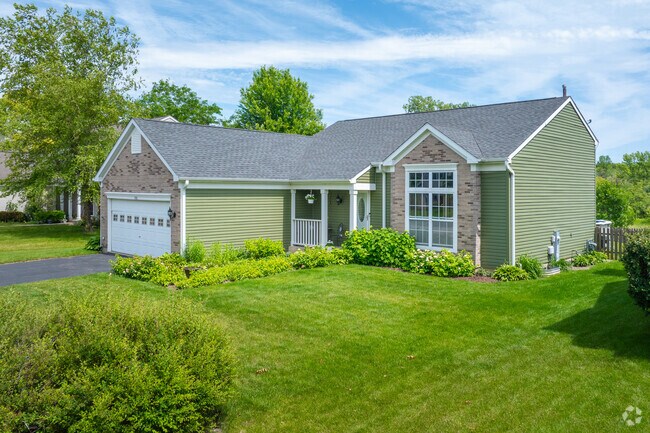 Ranch homes with brick facades sit on tidy lawns in Tiffany Farms.