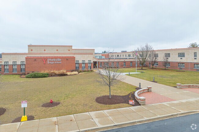 The entrance to Yorkville High School welcomes all through its doors.