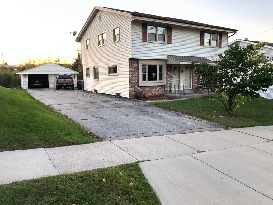 1 garage stall and half of driveway