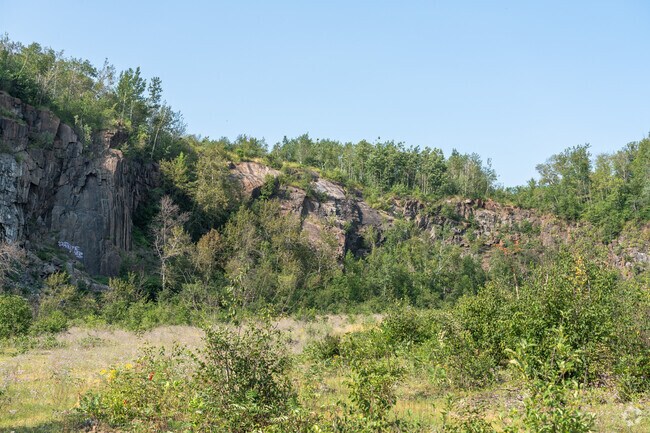 The rocky cliff face in Quarry Park adds to the beauty of the Cody neighborhood.