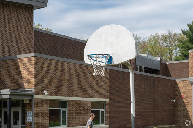 Play a game of hoops in the playground at J.A. Allard Elementary School.