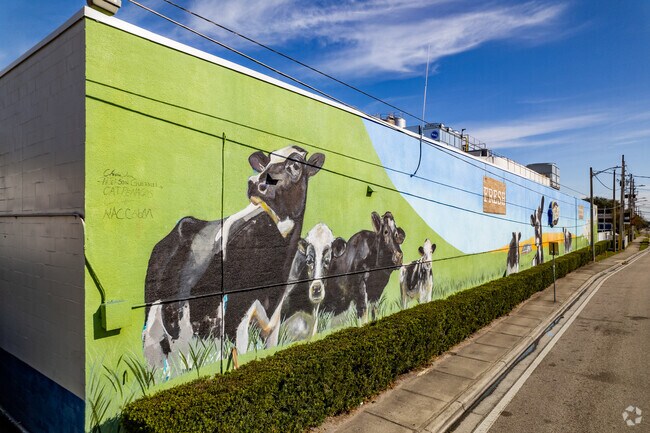 Take a photo along the cow mural wall located at the T.G. Lee Dairy Pure in the Milk District.