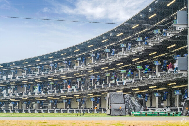 Enjoy the sweet sound of golf balls being hit at Topgolf in Firehouse.