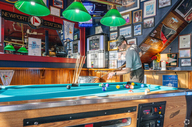 Lily-Almy Pond gather at the Thames St. Yacht Bar for cold drinks and billiards.