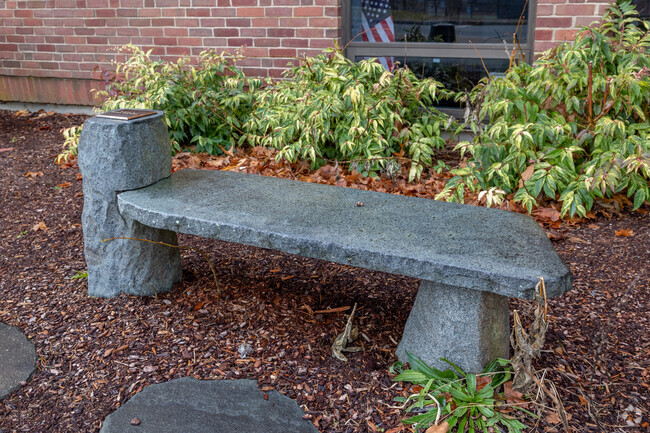 A memorial bench sits outside the entrance of Abigail Adams Middle School in Weymouth.