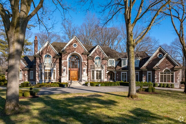 Residents of Bloomfield Hills enjoy large homes surrounded by dense old growth trees.