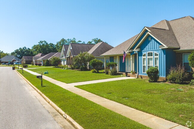 Some Fire Tower homes are Craftsman Style builds with well kept lawns.