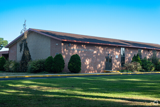Single story brick school in the Brightwaters area.