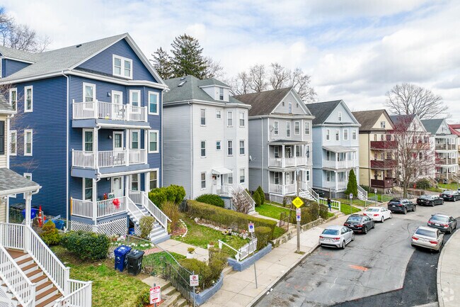 Triple decker homes line the streets of the Franklin Field North neighborhood.
