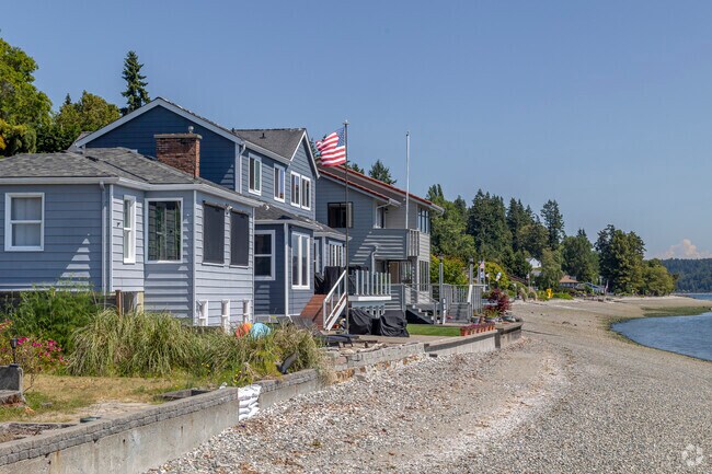 Beach bungalows and cape cods line the beaches of Manette WA.