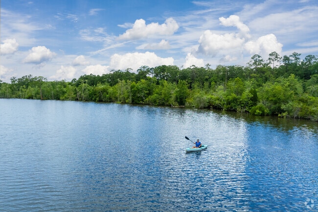 Kayaking in the river in Cypress Shores give you a scenic and nature inspired experience.