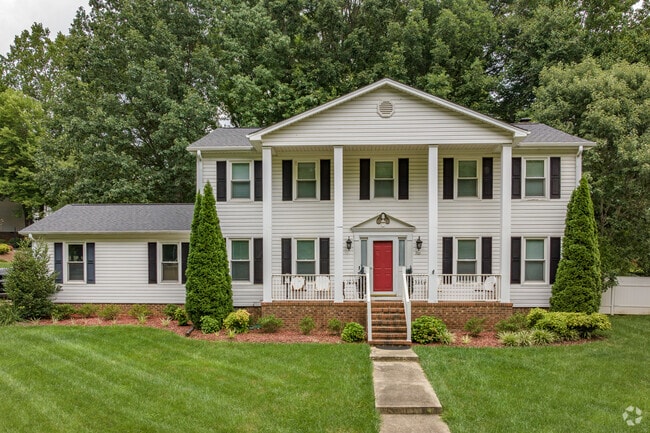 A colonial home in The Thicket sits under mature trees.