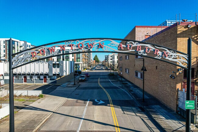 A sign welcomes visitors and residents home to Downtown Auburn.