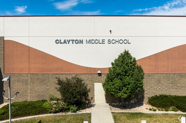 White and rust detail against a blue sky at Clayton Middle School.