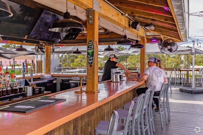 Grab a drink and a bite to eat at The Socials rooftop space in Downtown New Port Richey.