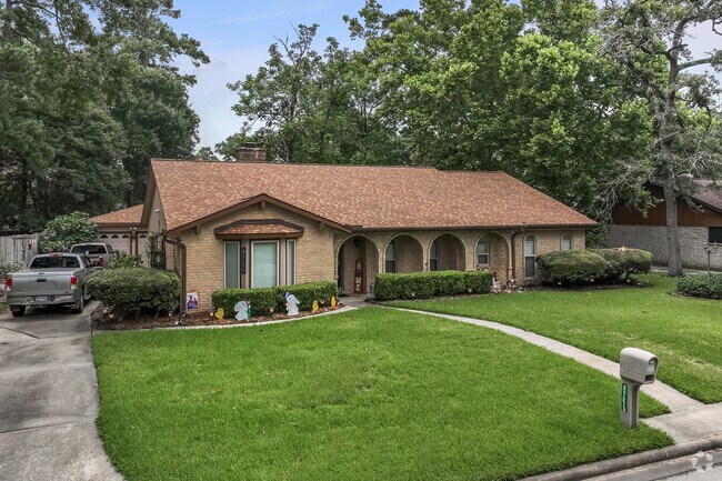 A one-story, ranch-style home with a large front porch in Oak Ridge North.