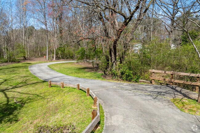 The Morrow Trail winds along a creek and past the City of Morrow Dog Park.
