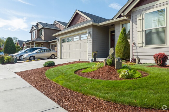 A contemporary home in North Image has perfectly shaped landscaping in it's front yard.