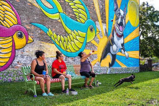 A colorful mural adds excitement to a small dog park in the Fort Howard neighborhood.