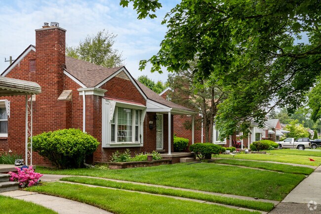 Old growth trees provide plenty of shade on properties in Far West Detroit.
