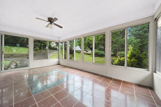 Sunroom at entry has view of the lake