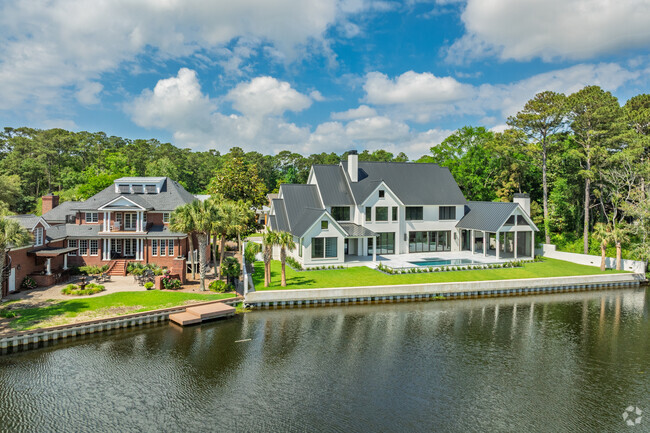 Elegant waterfront homes in Grande Dunes showcase upscale coastal architecture and views.
