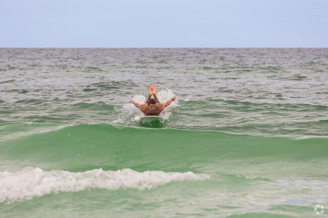 Surfers love a windy day in Dune Allen Beach to enjoy the waves.