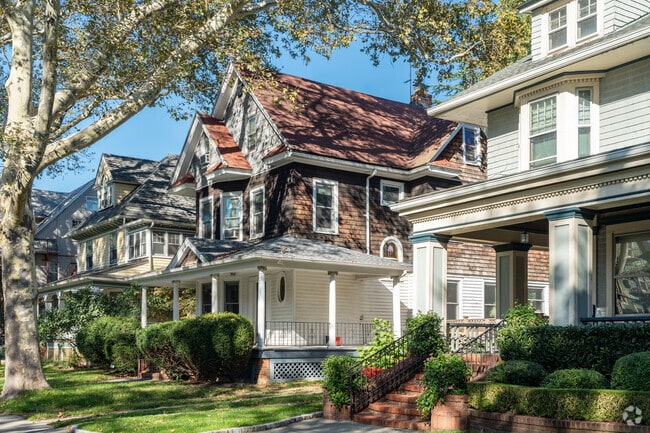 Many single family homes in Flatbush-Ditmas Park have manicured lawns and detached garages.