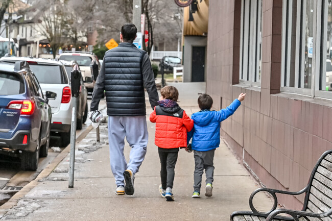 A dad and his boys enjoy a Saturday in Downtown East Lansing.