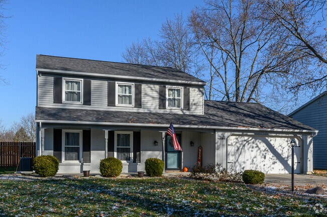 A traditional Colonial Revival home on a quiet street in Cambridge Oaks. .
