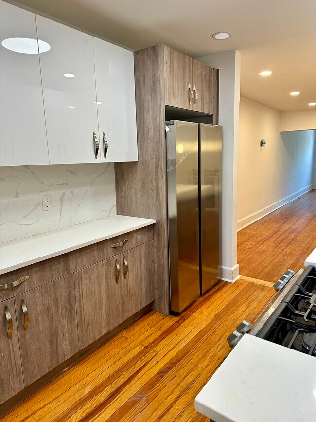 Newly renovated kitchen, stainless steel appliances, oversized SAMSUNG freezer/refrig.