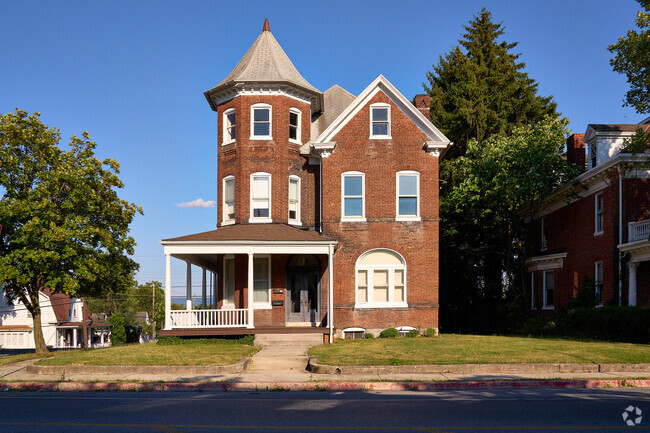 A brick construction victorian home represents architecture from times past.