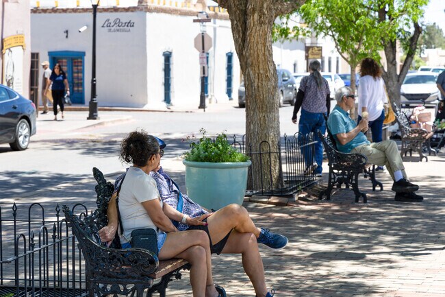 Relaxing on a bench at Mesilla Plaza offers a peaceful moment amidst historic charm.