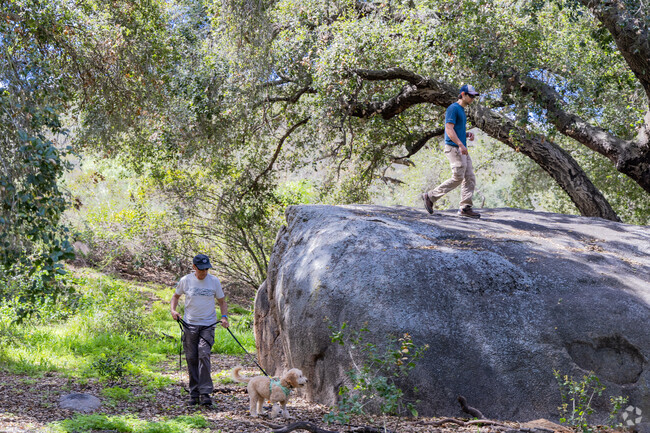 A family enjoys a walk through Crestridge Ecological Reserve near Granite Hills.