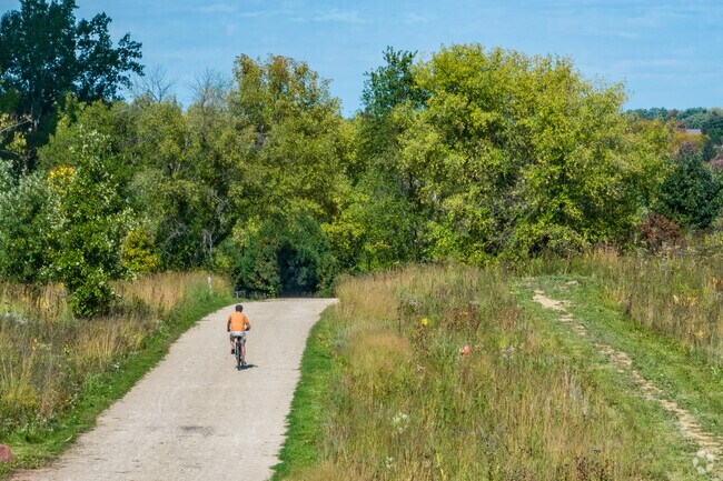A long, paved bike path winds through part of the Pheasant Branch Conservatory in Highland.
