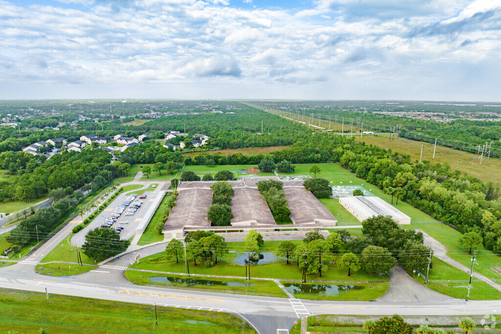 Trees and greenery surround Rivers Edge Elementary School.