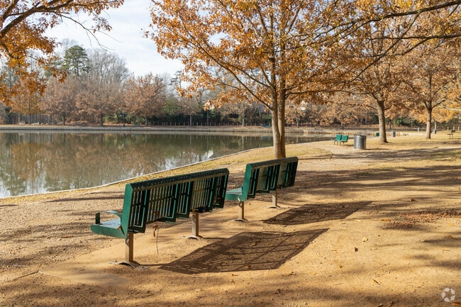 Chairs and lake view walking paths at Winston Lake Park.