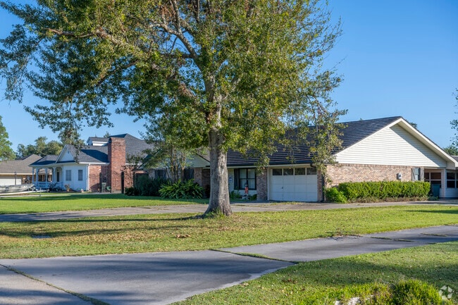 A ranch and an American traditional-style home on Rural Dr. in Bourg.