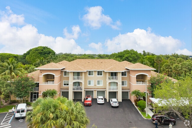 Elegant condos surrounded by lush greenery in the heart of Emerald Dunes.