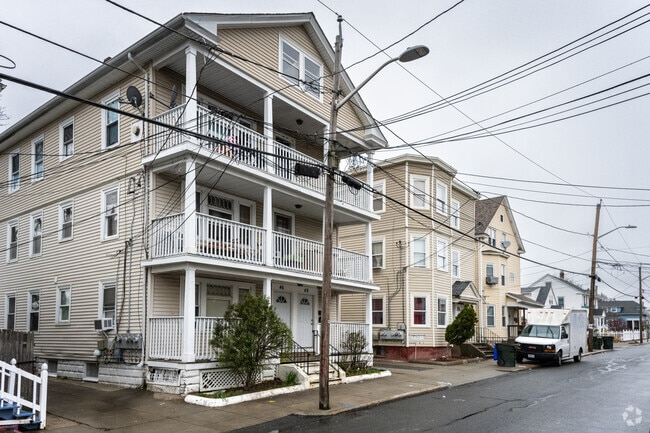 Many streets in Mount Pleasant are lined with triple decker multifamily residences.