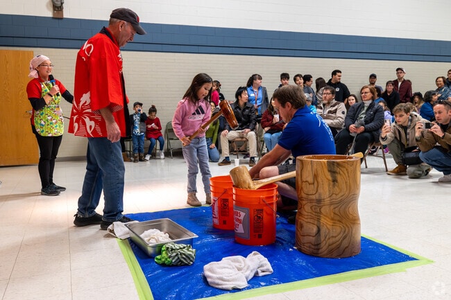 Kids can have fun pounding rice at the Rice Festival.