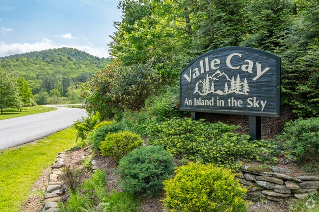 Valle Cay is a private, gated community in Vilas, featuring lakes, hiking trails, and homes designed to blend with the natural mountain landscape.